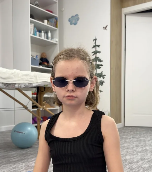 Copil la kinetoterapie pediatrică, 5–18 ani